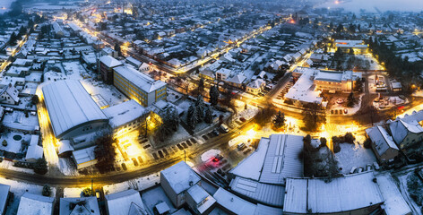 Wall Mural - Landscape with Village at winter night, panorama from drone.