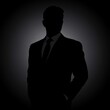 © Cloudyew - Dark Silhouette of a Businessman in a Sleek Modern Background