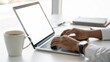 © Arts Oplurals - Working online typing laptop. A person types on a laptop at a clean desk, with a coffee cup nearby, creating a focused work environment.