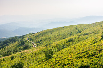 Wall Mural - beautiful view of mountain landscape in summer. outdoor adventure. green hill rolling in to the dist