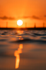 Wall Mural - Beautiful sunrise view from the water surface.