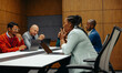 © Jacob Lund - Diverse team in collaborative office meeting discussing ideas