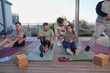© Caia Image - Disabled friends exercising on patio