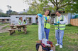 © Caia Image - Group of volunteers packaging donation boxes outdoors