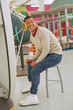 © Caia Image - Man sitting during sound experiment in science center