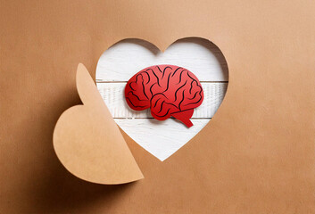 Wall Mural - Red Brain Cutout Inside Heart Shape on Brown Paper Background