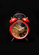 © Svetlana Kolpakova - Red Alarm Clock with Coffee Foam Face and Rising Steam Against Black Background