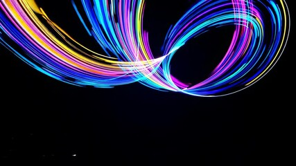 Aufkleber - Colorful light trails on black background, abstract motion art. Vibrant neon swirls, dynamic digital design concept