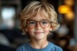 © Vesna - charming portrait of an adorable young boy wearing glasses looking directly at the camera with a playful smile capturing innocence and joy perfect for familyoriented themes