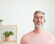 © Ryzhkov - Scandinavian Minimalism Virtual Workshop Tech-Savvy Middle-Aged Man with Wireless Headphones in Eco-Modern Workspace - Remote Work Solutions and Digital Collaboration