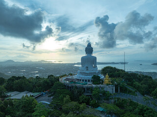 Wall Mural - aerial view stunning sky in sweet sunrise at Phuket big Buddha. .the sun shines through the clouds impact on ocean surface .The beauty of the statue fits perfectly with the charming nature.