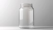 © Nathan - A clear glass jar with a wide mouth, showcasing its empty interior and sleek design against a soft gray background.