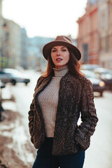 young woman winter portrait on city street