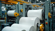 © Maryna - Large industrial machinery processes wood pulp into paper rolls inside modern paper mill. Advanced equipment transforms raw cellulose into finished products. Image shows efficient production process.