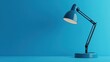 © Fenny - Blue desk lamp illuminates blue background