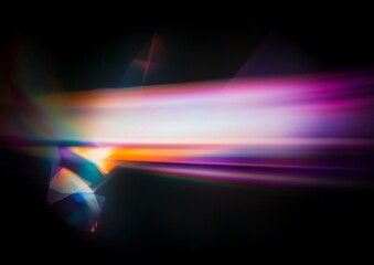 Wall Mural - abstract light streaks in vibrant hues of purple, orange, and teal against a dark background.