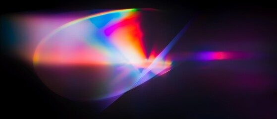 Wall Mural - abstract light painting with vibrant, multicolored streaks and glows on a black background.