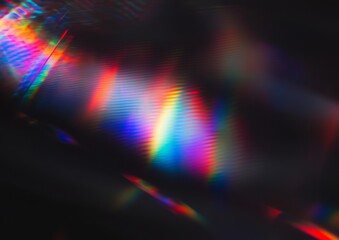 Wall Mural - vibrant rainbow light streaks on a dark background. a colorful abstract image.