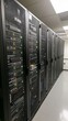 © Tri - Data center server racks in a modern facility.