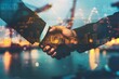 © MahmudulHassan - Businessmen shaking hands over blurred background. Business and partnership concept