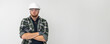 © puhimec - Portrait of a male builder. Engineer in overalls and helmet on a light background. Space for text.
