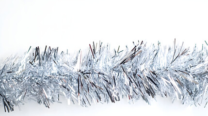 Wall Mural - silver tinsel on white background, festive holiday decoration.