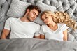© Georgy - At home, a comforting bed welcomes a happy couple to sleep soundly
