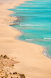 © Cavan Images - Detailed view of a white sand beach with turquoise water