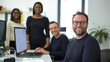 © liliyabatyrova - A diverse group of businesspeople engage in lively collaboration within a bright, modern office environment. Laughter and innovation fill the air as they work together on exciting projects