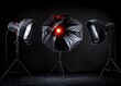 © Georgy - Photo studio lighting equipment featuring a flash and softbox, set against a black background
