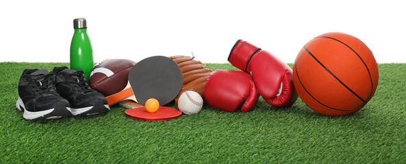 Wall Mural - Different sport equipment on green grass against white background