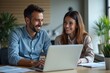 © Fazla - Happy Professional Business Man and Woman Working on a Laptop at an Office Meeting, Two Busy Colleagues Collaborating and Discussing a Business Plan Together. Generative AI