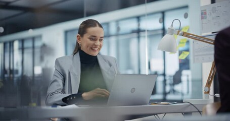 Poster - Young Hard Working Employee Achieves a Crucial Goal on Her Laptop Computer. Showing a Sense of Accomplishment. Manager Shares the Joy, Celebrating a Success Business Deal Behind Her Desk