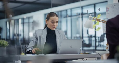 Poster - Young Professional Analyzing Business Data on Her Laptop Computer, Striving for Success. Suddenly, Female Manager Erupts in Celebration, Marking a Significant Achievement with a Fist Pump and Smile