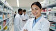 © StreamPixel - smiling female pharmacist wearing a white lab coat, standing confidently in a pharmacy. She is positioned in the foreground