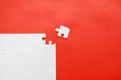 © monocle - White details of puzzle on red background. Business strategy, teamwork.