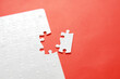 © monocle - White details of puzzle on red background. Business strategy, teamwork.