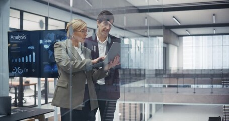 Aufkleber - Two Experienced Businesspeople Standing in a Meeting Room, Inspecting Latest Financial Report on a Laptop Computer. Caucasian Adult Male and Female Discussing Next Steps to Benefit the Company