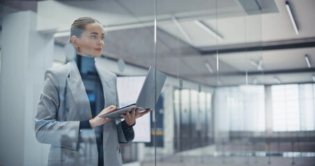 Aufkleber - Young Stylish Caucasian Female Using a Laptop Computer to Review Company Sales Reports and Inspect Commercial Data. Caucasian Project Manager Works in Modern Office, Browsing Information Online