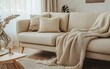 © Svitlana - A neutral-toned minimalist living area featuring a beige modern sofa, cozy textiles, and a clean aesthetic