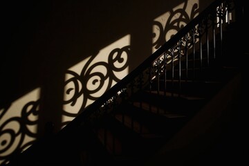 Poster - intriguing shadows on the staircase: an elegant dance of light and design in a modern interior
