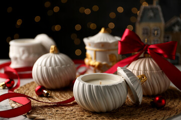 Wall Mural - Soy wax candles on table, closeup. Beautiful Christmas decor