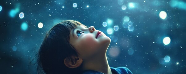 Wall Mural - a child's face full of wonder as they gaze up at the stars.