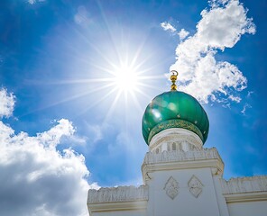 The green dome of the historic Nguyen Minaret and white walls of Masjid al-Nabawi in Mecca, stock photo with blue sky and clouds in the background. 