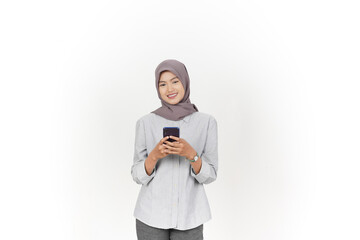 Smiling and Using Smartphone Of Beautiful Asian Woman Wearing Hijab Isolated On White Background