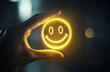 © HNXS Digital Art - glowing smiley face illuminated by a hand in a dark background, positive emotion concept