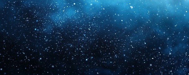 Wall Mural - snowflakes falling gently against a dark blue winter night sky.