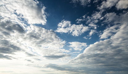 Wall Mural - gorgeous and spectacular vivid clouds illuminated by the rays of the sun.