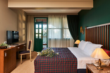 Wall Mural - Green hotel room concept interior style, old furniture retro decoration.