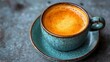 © ภูริพัฒน์ ภิรมย์กิจ - Aromatic Espresso in Blue: A rich, frothy espresso rests in a vibrant teal ceramic cup, the warm, inviting crema promising a moment of pure indulgence.